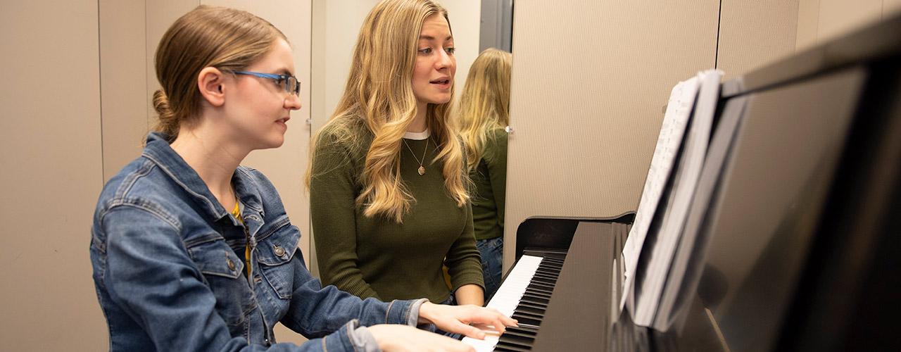 Female pianist accompanying a female soloist