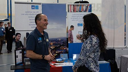 Student talking to employer at the Career Fair