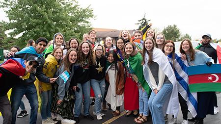 International Students posing in the homecoming parade