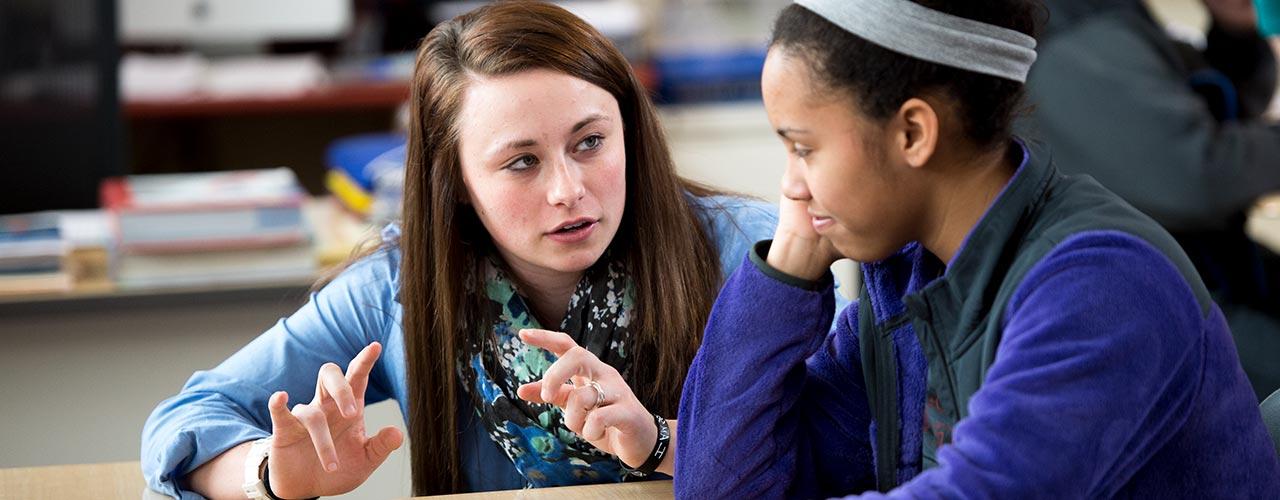 Two female education students having a discussion