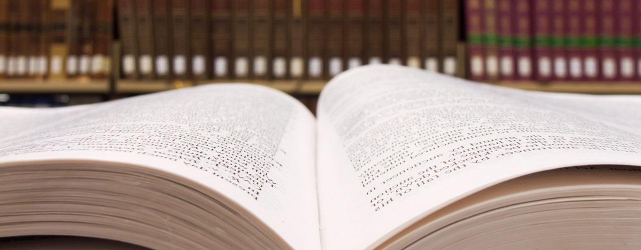 Book lays open on a table in the library