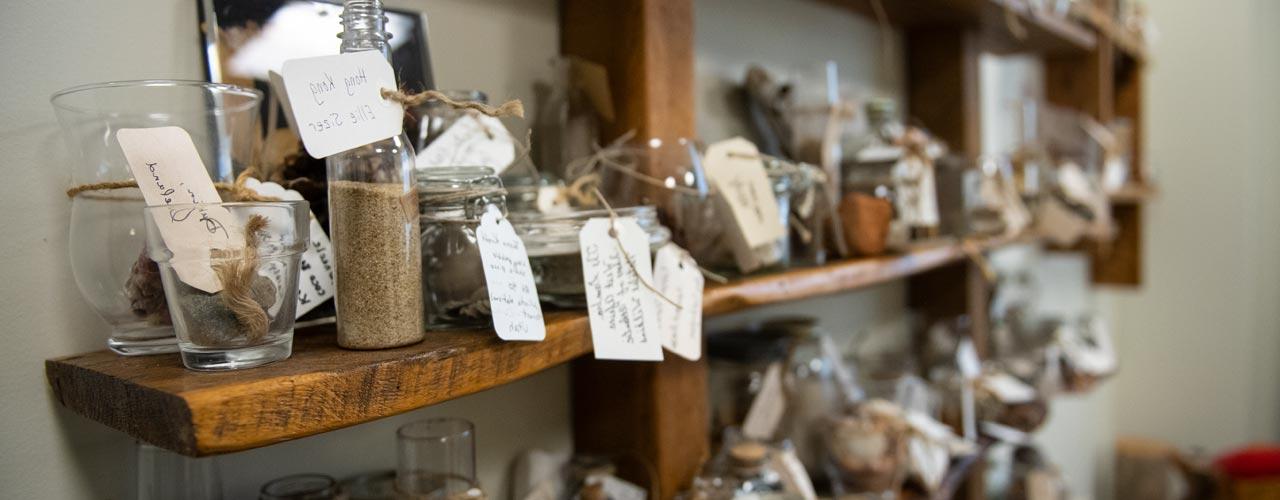 picture of glass objects with tags on a shelf in the Cove