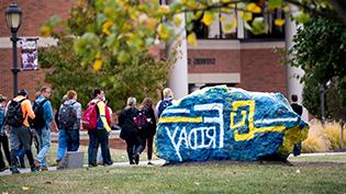 Cedarville's rock painted with CU Friday logo