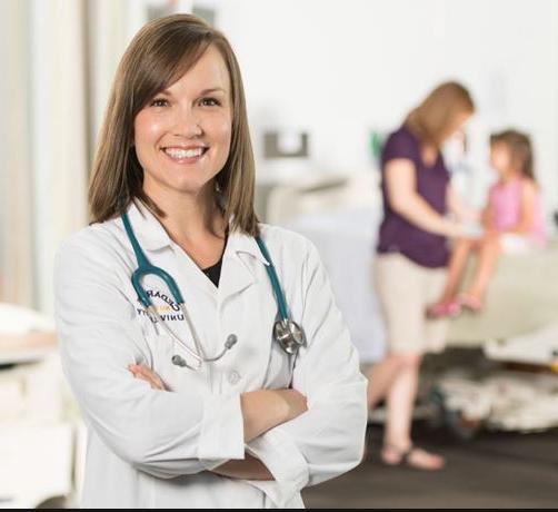 Nurse practitioner st和ing in front of patient